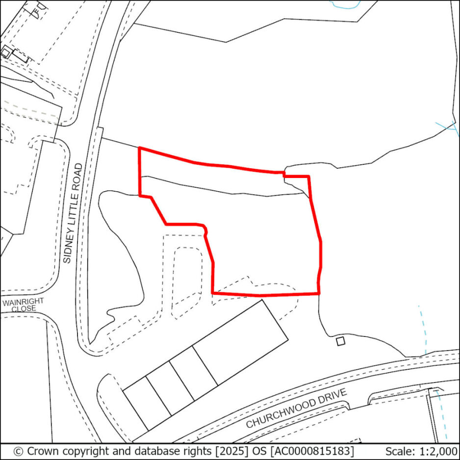 Outline of a land parcel marked with a red boundary line on a map, adjacent to Sidney Little Road and Churchwood Drive, with surrounding roads and some plotted structures.